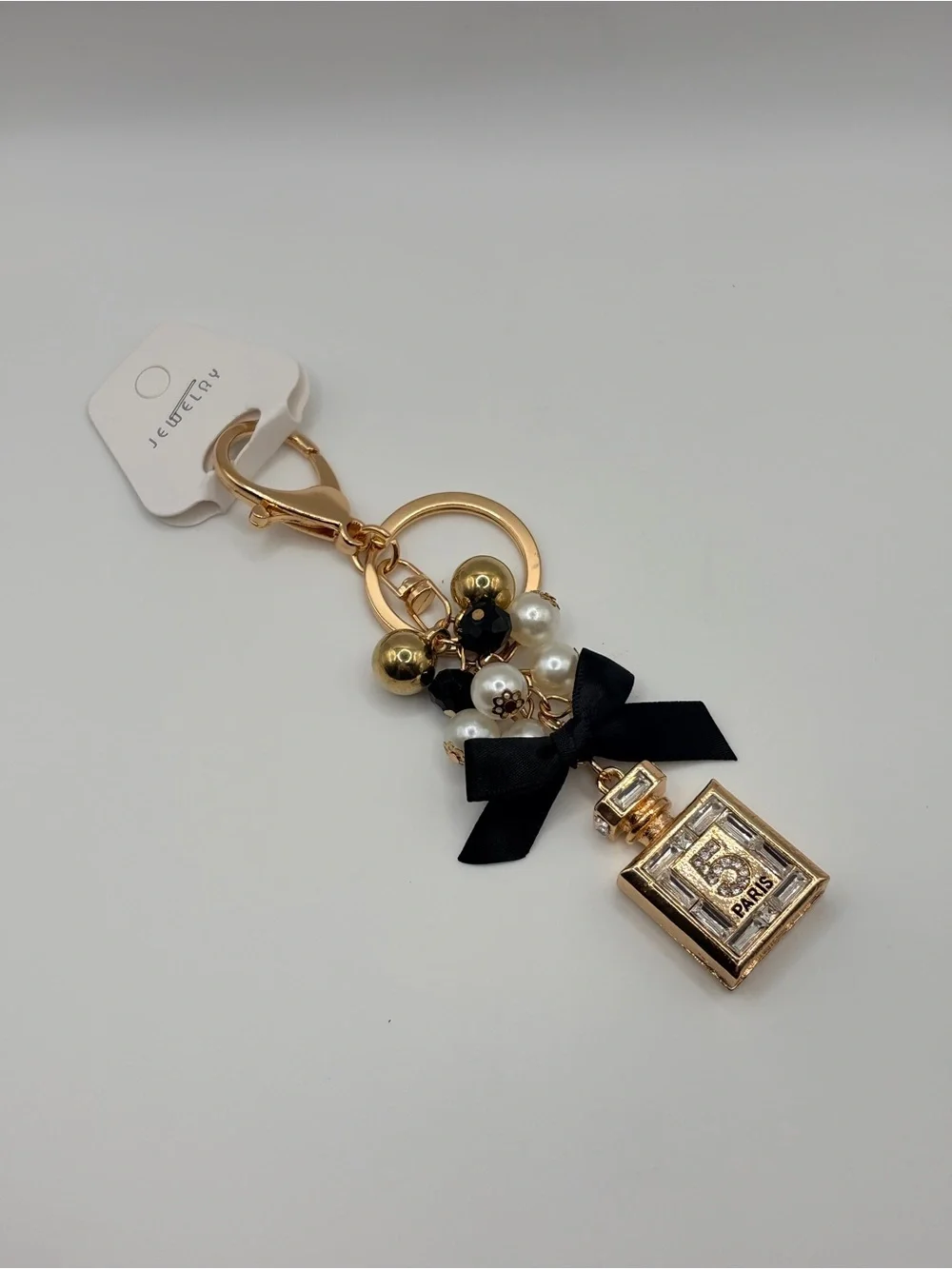 Gold Perfume Bottle Keychain with Black Bow and Pearls